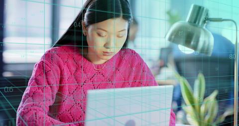 Asian Businesswoman Analyzing Data with Digital Overlay in Office - Download Free Stock Images Pikwizard.com