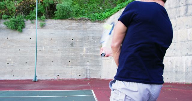Man Practicing Tennis Alone Against Wall Outdoors - Download Free Stock Images Pikwizard.com
