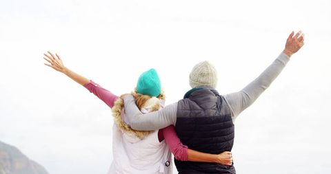 Couple embracing outdoors adventure mountain scenery