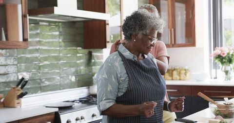 Senior African American Women Enjoying Cooking Together in Modern Kitchen - Download Free Stock Images Pikwizard.com