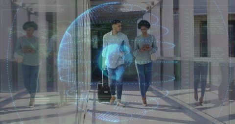 Business travelers walking glass concourse pulling suitcase checking phone with hologram globe