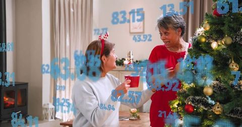 Two friends decorating christmas tree with cozy holiday decor and blue data overlay
