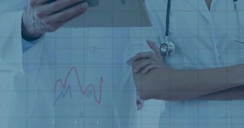 Doctors reviewing digital patient data on tablet with analytics overlay and stethoscope