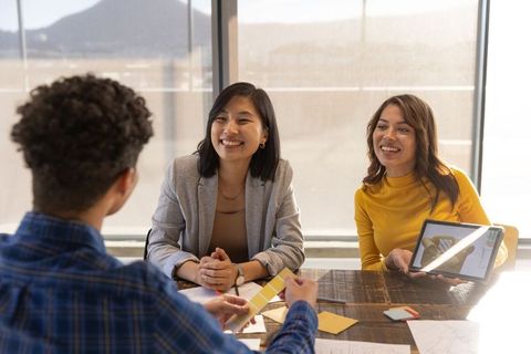 Diverse Team Collaborating on Design Project with Technology