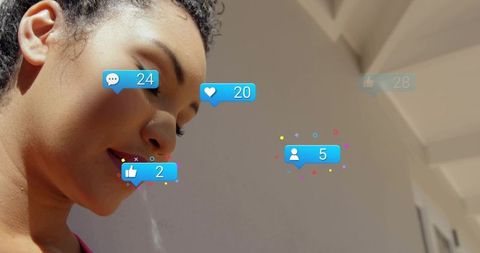 Curly haired woman gazing down with social media notification icons, sunlit headshot