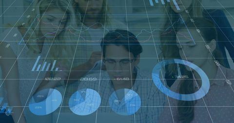 Young Professionals Using Digital Analytics at Business Meeting