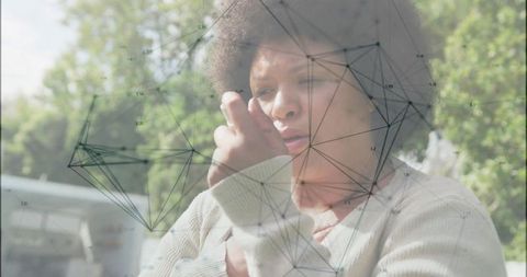 Woman Checking Smartwatch in Sunny Park with Network Overlay