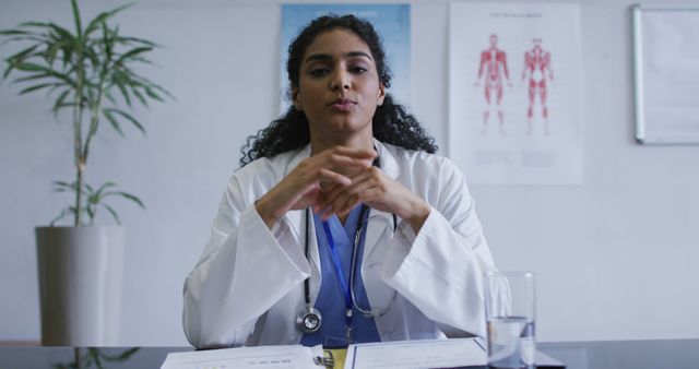 Confident Female Doctor in Consultation Room Giving Advice - Download Free Stock Images Pikwizard.com