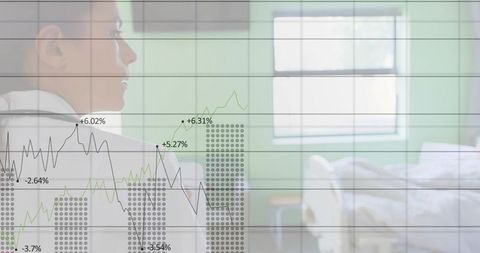 Doctor Analyzing Medical Chart Beside Hospital Bed
