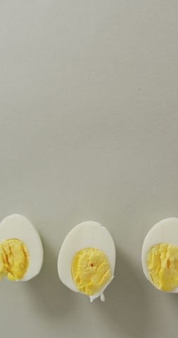 Minimalist arrangement of hard boiled egg halves