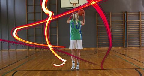 Dynamic Female Basketball Player in Energetic Gym Action