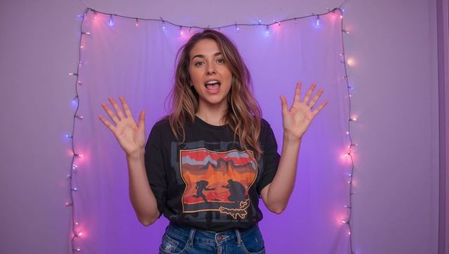 Vlogger communicating enthusiastically in trendy home studio