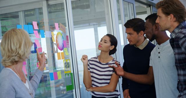 Diverse Team Discussing Project Ideas with Post-It Notes - Download Free Stock Images Pikwizard.com