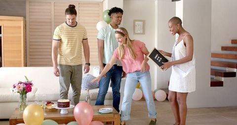 Friends Celebrating Birthday At Home with Joy and Decorations