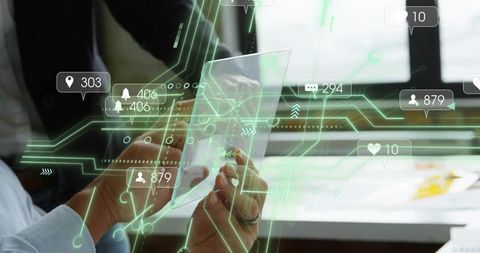 Team holding transparent tablet with AR overlays for futuristic office collaboration