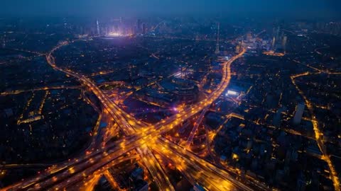 Urban Dusk: Glowing Arterials and Nightfall Over Interchange