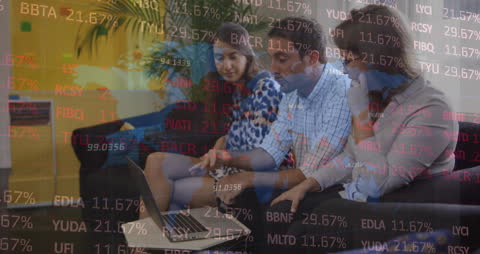 Team Analyzing Stock Market Data on Laptop in Office Environment