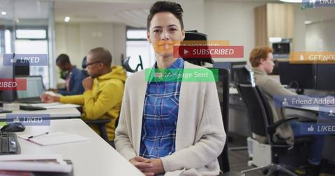 Professional woman sitting in modern open office with social media notification overlays