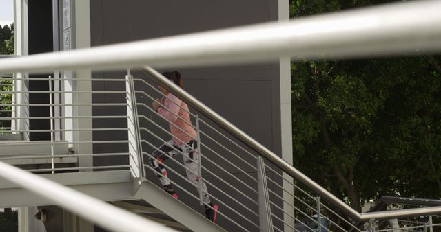 Woman Climbing Outdoor Staircase in Urban Environment - Download Free Stock Images Pikwizard.com