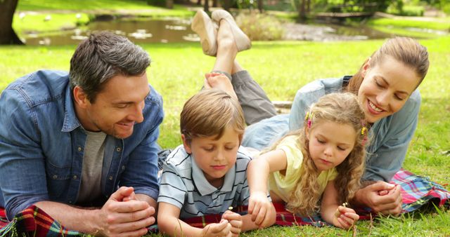 Happy Family Enjoying Outdoor Picnic Together - Download Free Stock Images Pikwizard.com