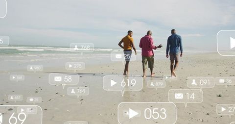 Three men walking on beach holding phone with floating social media engagement icons overlay