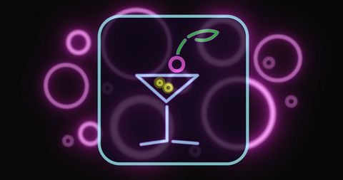Neon Cocktail Glass with Vibrant Pink Bubbles