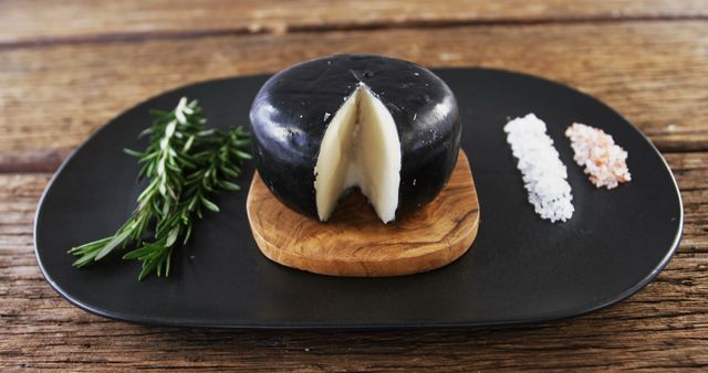 Gourmet Black Cheese Wheel with Rosemary and Salt on Wooden Background - Download Free Stock Images Pikwizard.com