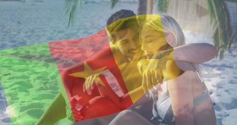 Couple Embracing on Beach with Cameroon Flag Overlay