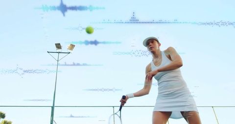 Female Tennis Player Swinging Racket for Dynamic Serve