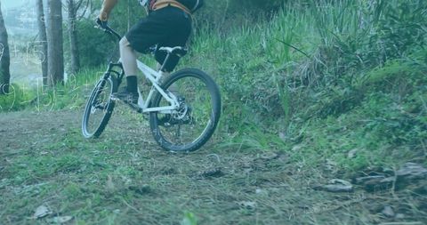 Mountain Biker Enthusiast Traveling Through Forest Trail for Adventure