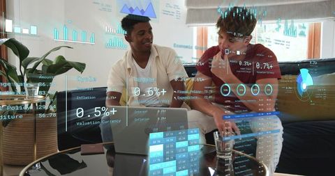 Collaborating on holographic finance dashboards while pointing at laptop, home analytics