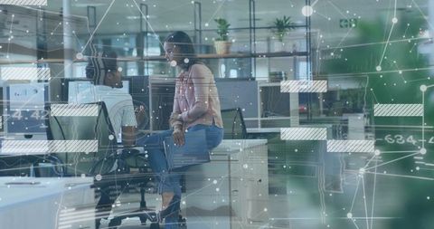 Business Colleagues Having Strategic Discussion in Modern Office