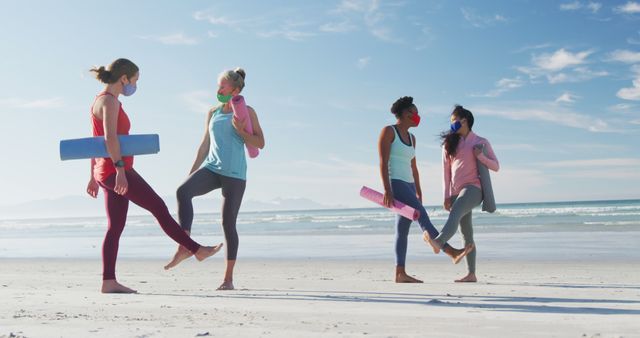 Women Practicing Yoga Together on Beach Wearing Masks - Download Free Stock Images Pikwizard.com