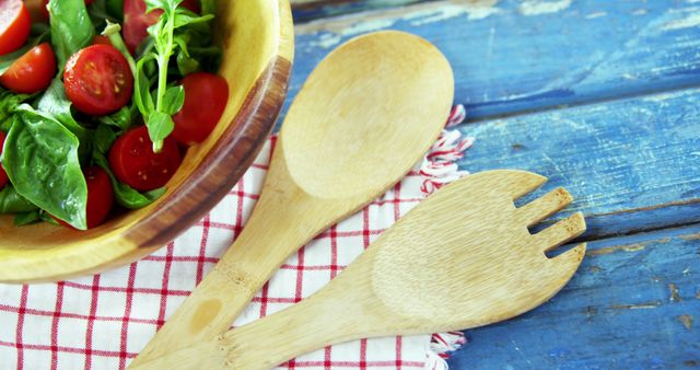 Fresh Summer Salad in Wooden Bowl with Salad Serving Utensils on Rustic Table - Download Free Stock Images Pikwizard.com