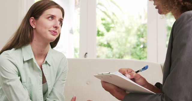 Young Woman in Therapy Session Discussing with Therapist - Download Free Stock Images Pikwizard.com