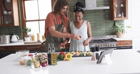 Happy Couple Cooking Together in Contemporary Kitchen Setting - Download Free Stock Images Pikwizard.com