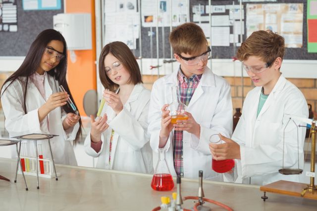 Attentive School Kids Conducting Chemical Experiment in Laboratory - Download Free Stock Photos Pikwizard.com