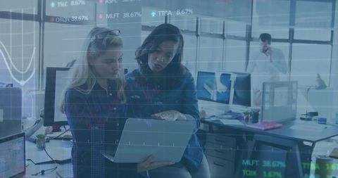 Colleagues Analyzing Data in Open-Plan Office