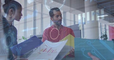 Team collaborating with data visualizations in office meeting