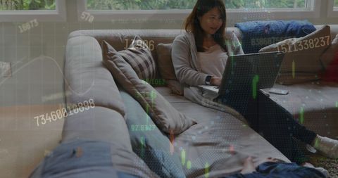 Asian Woman Analyzing Financial Data on Laptop at Home - Download Free Stock Images Pikwizard.com