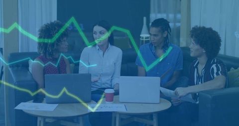 Creative Team Analyzing Financial Data on Laptops