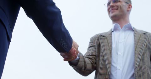Caucasian Businessmen Shaking Hands Outdoors in Formal Agreement - Download Free Stock Images Pikwizard.com