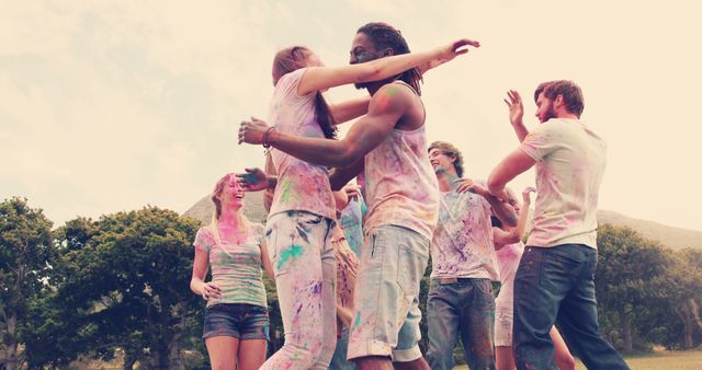 Group of Friends Celebrating Holi Covered in Colorful Powder Outdoors - Download Free Stock Images Pikwizard.com