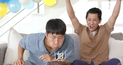 Joyful Indoor Birthday Celebration with Cake and Balloons