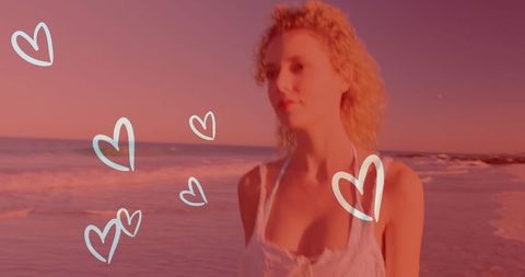 Romantic Beach Sunset with Contemplative Woman in Soft Pink Hue