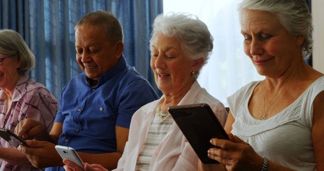 Senior Adults Using Smartphones and Tablets in Relaxed Setting - Download Free Stock Images Pikwizard.com