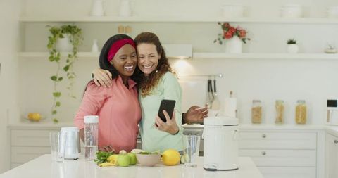 Diverse Friends Taking Selfie in Modern Kitchen with Blender