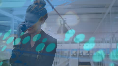 Smiling Businesswoman Talking on Smartphone with Data Overlay