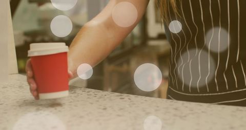 barista serving takeaway coffee with spot light overlay - Download Free Stock Images Pikwizard.com