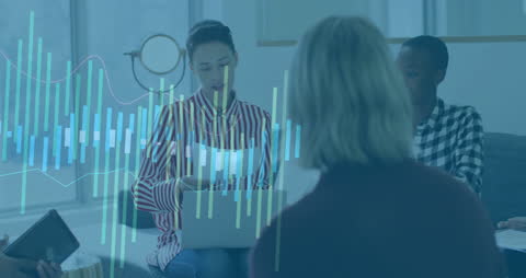 Diverse Colleagues Collaborating with Financial Data Overlay